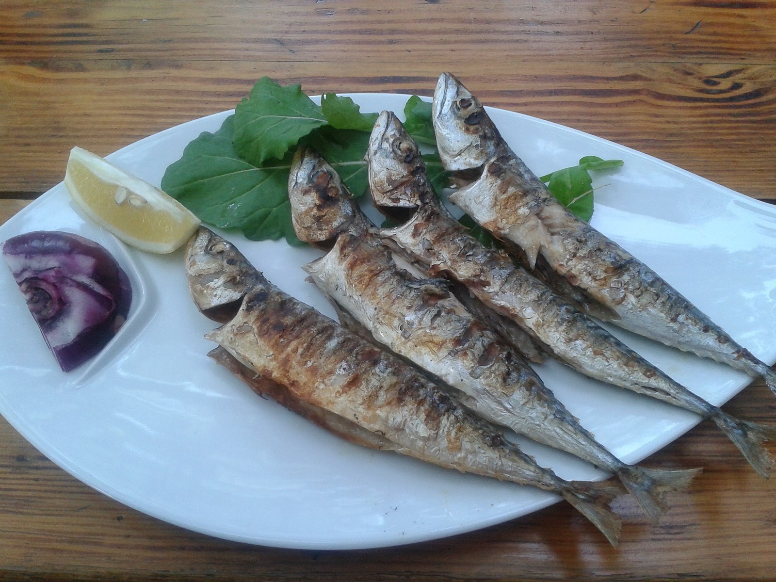 A whole grilled fish — priced by weight before it reached the grill